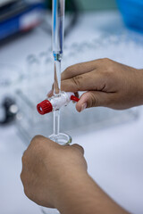 Scientist working Titration technique in the laboratory.