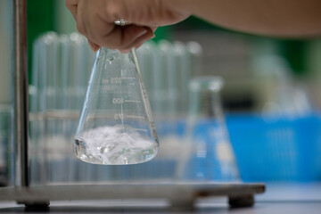 Scientist working Titration technique in the laboratory.