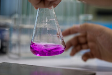 Scientist working Titration technique in the laboratory.