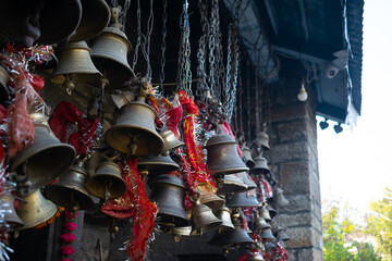 Temple bells tied outside ancient temple. Religious, religion, hindu, hinduism, people, worship,...