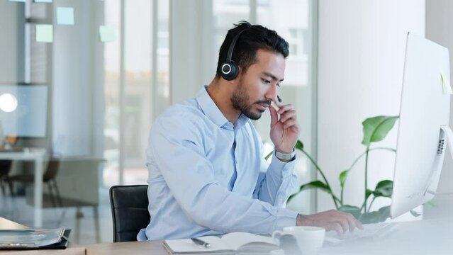 Call center agent answering calls in the office and consulting online via video call at his workplace. Latino American customer service or helpdesk employee advising on a virtual sales meeting
