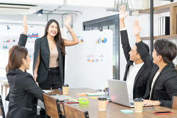 Happy Business People At Computer Celebrating Success At Work Sitting In Modern Office. Successful Negotiations. business team looking at the computer monitor.
