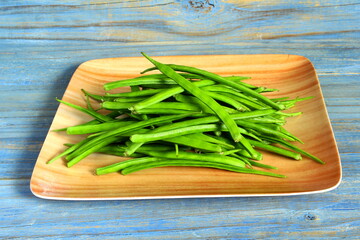  garden fresh indian vegetable green cluster beans or guar beans in dish also known in india as...