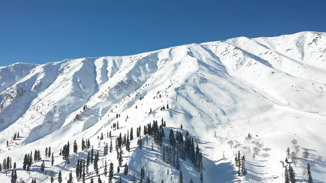 Drone view of the Kashmir mountain peak in the wintertime