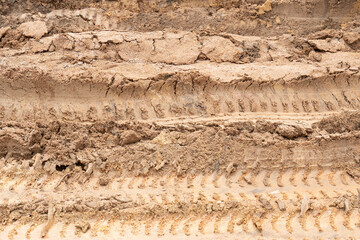 Wheel drift on dry muddy roads. Dirt road surface for transport background.