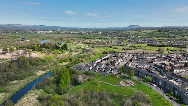 Aerial Video of Ballykeel residential buildings Braid River and Slemish Mountain Ballymena Co Antrim Northern Ireland