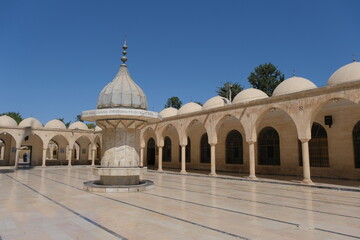 Fototapeta premium Inside the ancient mosque yard in Sanliurfa, Turkey. Mosque made of limestone. 07.11.2022. Sanliurfa. Turkey