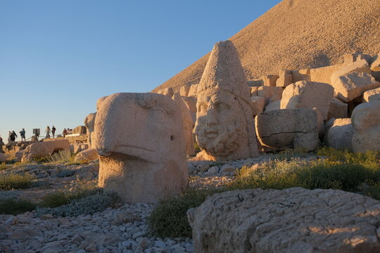 Low angle view of sculptures king of commagene during sunset at Nimrod mountain, local name is Nemrut Dagi.