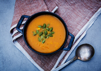 Pumpkin soup with pumpkin seed garnish