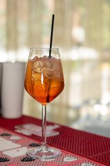 Spritz Cocktail in glasses with ice and orange slice on light  background.