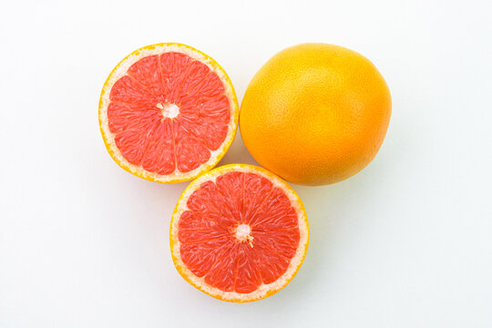 Closeup view of grapefruit on white background.