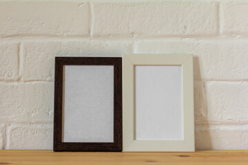 Empty photo frames on the table with copy space.