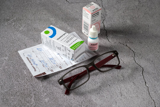 Rivne, Ukraine - July 31, 2022 - Unimed Pharma potassium iodide, Thealoz Duo Othea ophthalmic solution, paper prescription for glasses