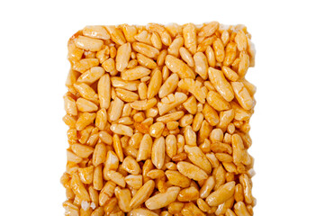 Sweetness from grains of puffed rice, shot close-up on a white background.