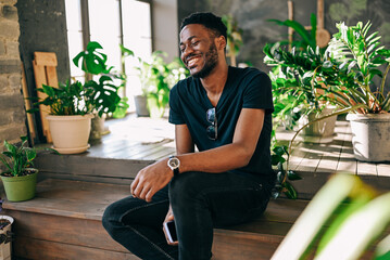 Portrait of attractive young man looking smiling to camera. Friendly happy decent person face...