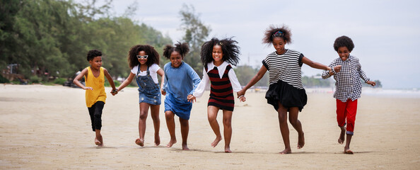 Banner size. Funny vacation. Children or kids playing and romp together at the beach on holiday