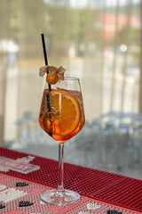 Spritz Cocktail in glasses with ice and orange slice on light  background.