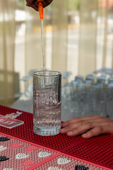 preparing a cocktail with berries at the wedding