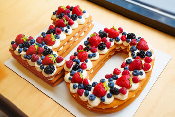 cake with berries in the form of the number ten.