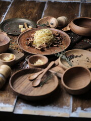 Pasta on wooden plates, on a dark background, food photography.