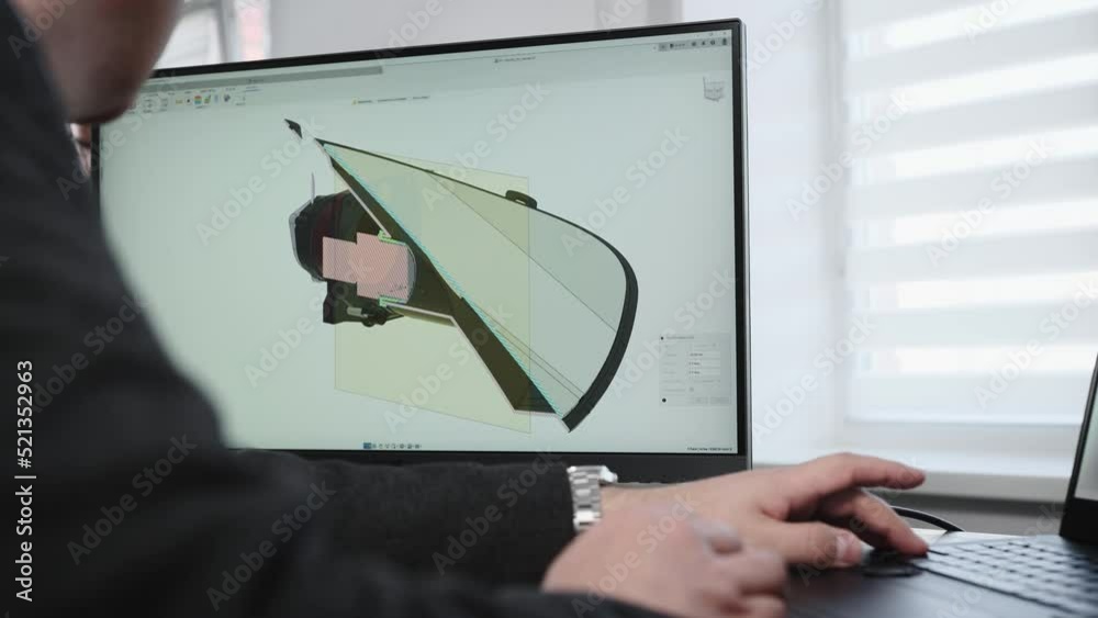 Wall mural an unrecognizable man develops the design of a part. an engineer works with a 3d model in a design p