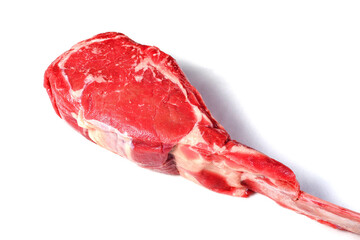 Fresh uncooked tomahawk steak on the bone on white background. Prime cut of beef. High quality product with marbling and delicate flavor for special occasion.. Butcher craft.
