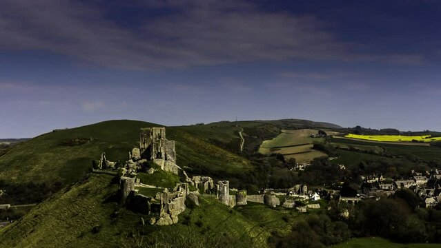 Time lapse shot of clouds moving over the Corfe Castle