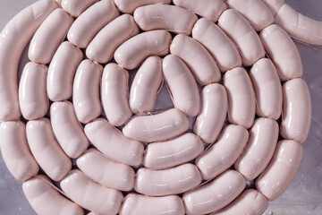 factory for the production of sausages, workers make sausage. meat industry concept