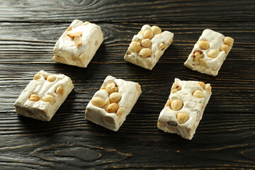 Concept of tasty food on wooden table, nougat