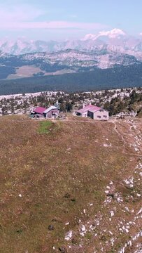 Vertical aerial view of the houses in French alps on a sunny day