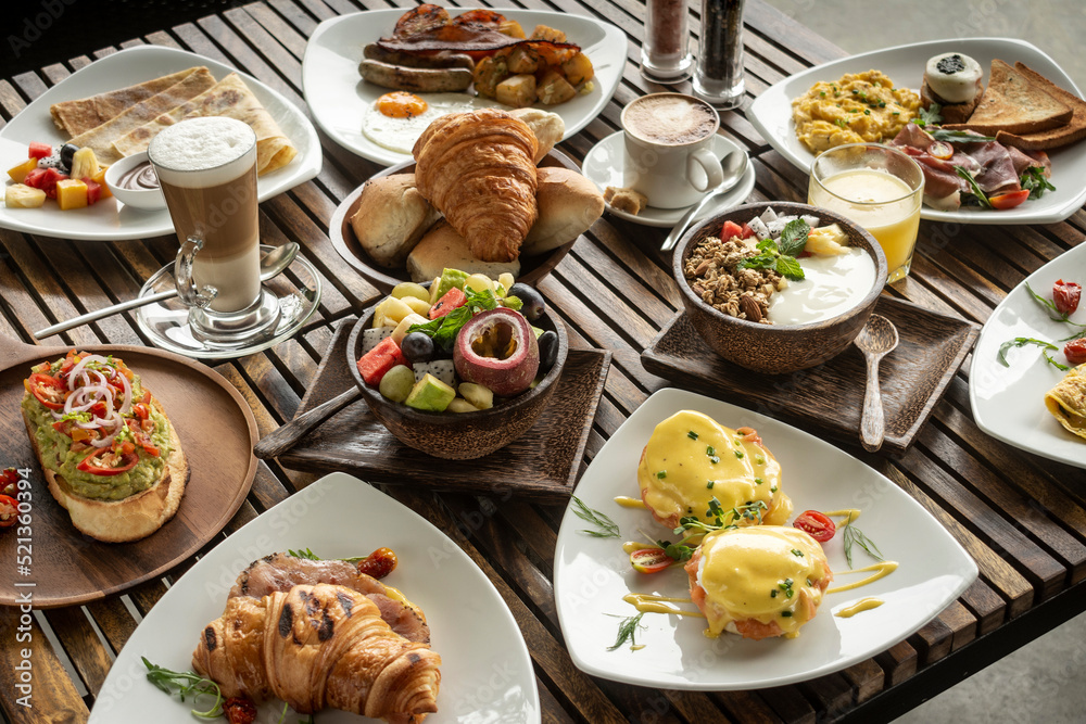 Wall mural many mixed western breakfast food items on cafe table