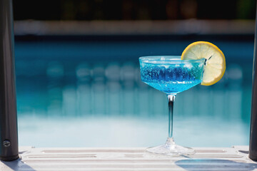 A glass of delicious blue cocktail 