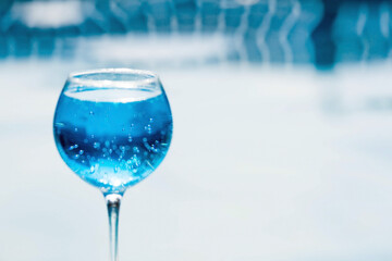 A glass of delicious blue cocktail 