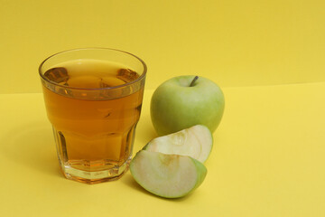glass of apple juice and apple