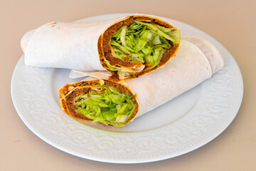 Traditional Turkish Raw Meat Wrap ( Turkish Name : Cig Kofte Durum ). Raw Meat in roll of bread lavash. Turkish food. 