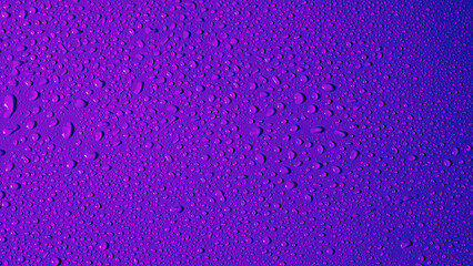 Purple background with water drops. Neon color with a gradient from magenta to blue. Copy Space.