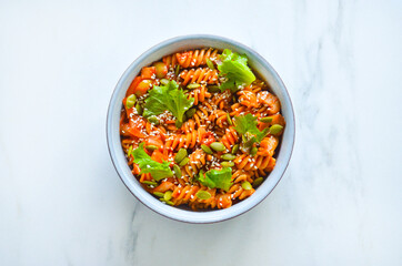 A homemade vegan pasta with greens and tomatoes. Good for any project.