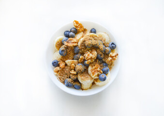 An oat cereal with blueberries, nuts and banana. Good for any project.