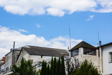 A small watchtower next to a white-walled prison