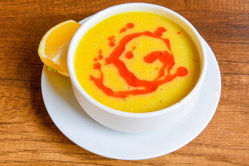 Lentil ( mercimek ) soup with melted butter and red pepper sauce