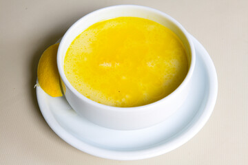 Lentil ( mercimek ) soup with melted butter and red pepper sauce