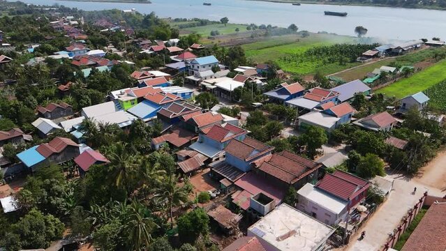 Aerial footage over a small village in a tiny island on the Mekong river, Koh Okhna Tey, few kilometers from Phnom Penh city, Capital of Cambodia  2-2