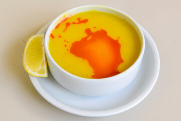 Lentil ( mercimek ) soup with melted butter and red pepper sauce
