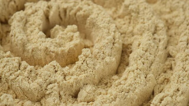 Ginger spicy. Ground ginger close up, rotating