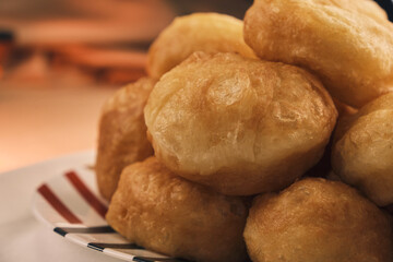 Close up of a lot of freshly baked Boortsog (baursak) traditional food of kazakh in the sunrise at home