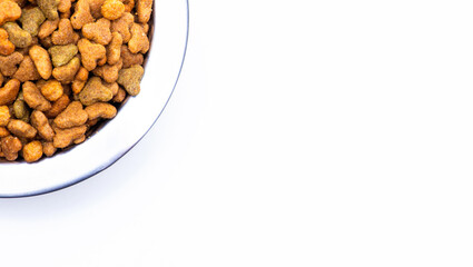 Close-up of balanced dry pet food in a metal plate for cats and dogs