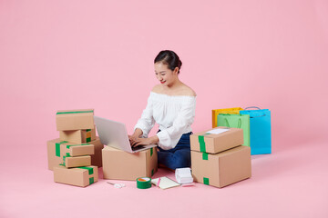 Young asian woman is entrepreneur work from home with online on notebook