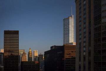 The top of some emblematic Chicago skyscrapers at sunrise