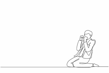 Single continuous line drawing happy businessman kneeling with gesture of both hands yes.