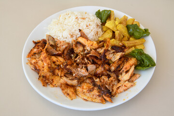 Turkish and Arabic Traditional Ramadan chicken doner kebab with tasty tomato sauce and rice or...